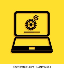 Black Laptop and gears icon isolated on yellow background. Adjusting app, service, setting options, maintenance, repair, fixing laptop concepts. Long shadow style. Vector.