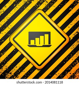 Black Laptop with graph chart icon isolated on yellow background. Report text file icon. Accounting sign. Audit, analysis, planning. Warning sign. Vector