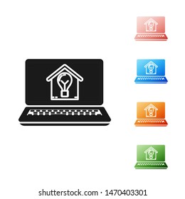 Black Laptop with smart house and light bulb icon isolated on white background. Set icons colorful. Vector Illustration