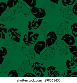 Black leaves on a green background. Seamless.