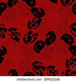 Black leaves on a red background.