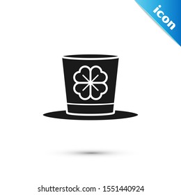 Black Leprechaun hat and four leaf clover icon isolated on white background. Happy Saint Patricks day.  Vector Illustration