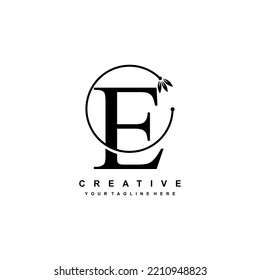 black letter E logo template with floral ornaments and circular lines. elegant and luxurious letter E logo design. beautiful letter E logo vector. E icon