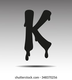 black letter K in the form of current liquid paint