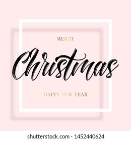 Black lettering Christmas in the square frame on pink background. Golden Merry christmas and happy new year wishes. Minimal modern style.