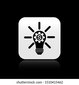 Black Light bulb with gear inside and dollar symbol icon isolated on black background. Fintech innovation concept. Silver square button. Vector Illustration