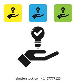 Black Light bulb in hand icon isolated on white background. Concept of idea. Set icons colorful square buttons. Vector Illustration