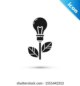 Black Light bulb with leaf icon isolated on white background. Eco energy concept. Alternative energy concept.  Vector Illustration