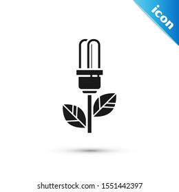 Black Light bulb with leaf icon isolated on white background. Eco energy concept. Alternative energy concept.  Vector Illustration