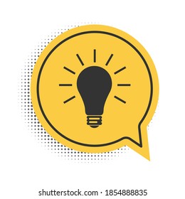 Black Light bulb with rays shine icon isolated on white background. Energy and idea symbol. Lamp electric. Yellow speech bubble symbol. Vector.