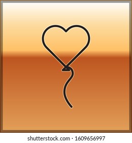 Black line Balloons in form of heart with ribbon icon isolated on gold background. Valentines day symbol.  Vector Illustration
