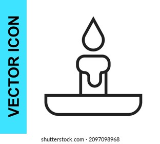 Black line Burning candle in candlestick icon isolated on white background. Cylindrical candle stick with burning flame.  Vector