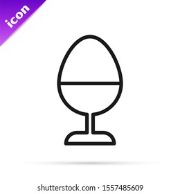 Black line Chicken egg on a stand icon isolated on white background.  Vector Illustration