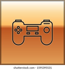 Black line Gamepad icon isolated on gold background. Game controller.  Vector Illustration