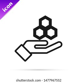 Black line Honeycomb and hand icon isolated on white background. Honey cells symbol. Sweet natural food.  Vector Illustration