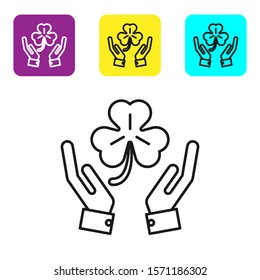 Black line Human hands holding four leaf clover icon isolated on white background. Happy Saint Patrick day. Set icons colorful square buttons. Vector Illustration