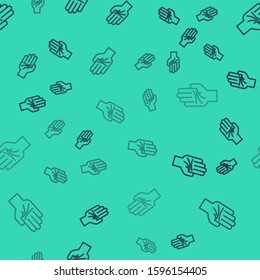 Black line Palmistry of the hand icon isolated seamless pattern on green background.  Vector Illustration