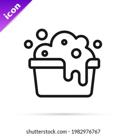 Black line Plastic basin with soap suds icon isolated on white background. Bowl with water. Washing clothes, cleaning equipment.  Vector