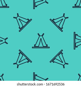 Black line Traditional indian teepee or wigwam icon isolated seamless pattern on green background. Indian tent.  Vector Illustration