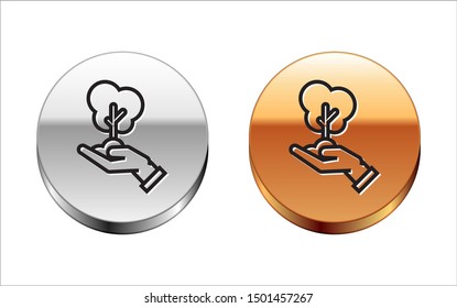 Black line Tree in hand of environmental protection icon isolated on white background. Seed and seedling. Planting sapling. Ecology concept. Silver-gold circle button. Vector Illustration