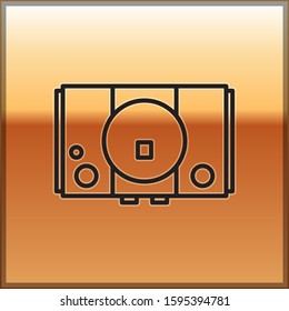 Black line Video game console icon isolated on gold background.  Vector Illustration
