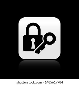 Black Lock and key icon isolated on black background. Padlock sign. Security, safety, protection, privacy concept. Silver square button. Vector Illustration
