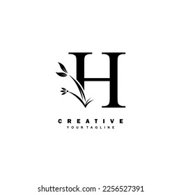 black luxury H logo design with beautiful floral and leaf ornament decoration. initial H letter logo. monogram H typography. feather logo