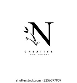 black luxury N logo design with beautiful floral and leaf ornament decoration. initial N letter logo. monogram N typography. feather logo