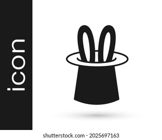 Black Magician hat and rabbit ears icon isolated on white background. Magic trick. Mystery entertainment concept.  Vector