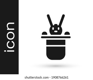 Black Magician hat and rabbit icon isolated on white background. Magic trick. Mystery entertainment concept.  Vector