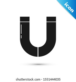 Black Magnet icon isolated on white background. Horseshoe magnet, magnetism, magnetize, attraction.  Vector Illustration