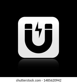 Black Magnet with lightning icon isolated on black background. Horseshoe magnet, magnetism, magnetize, attraction sign. Silver square button. Vector Illustration