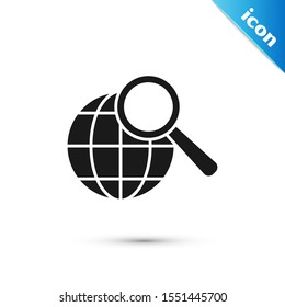 Black Magnifying glass with globe icon isolated on white background. Analyzing the world. Global search sign.  Vector Illustration