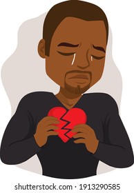 Black man crying sad holding broken heart feeling hurt