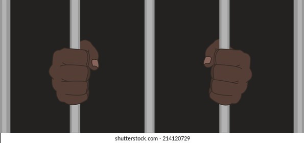 Black man fists in darkness holding prison bars