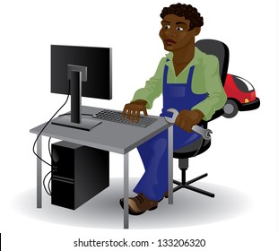 black man, mechanic, sitting at the computer with a wrench in his hand