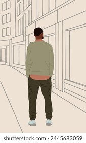 Hombre negro de pie vista trasera en la calle de la ciudad.