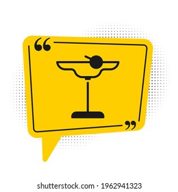 Black Margarita cocktail glass with lime icon isolated on white background. Yellow speech bubble symbol. Vector