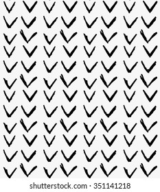 Black marker check marks in row.Free hand drawn with ink brush seamless background. Abstract texture. Modern irregular tilable design.