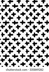 Black marker drawn simple crosses.Hand drawn with paint brush seamless background. Abstract texture. Modern irregular tilable design.