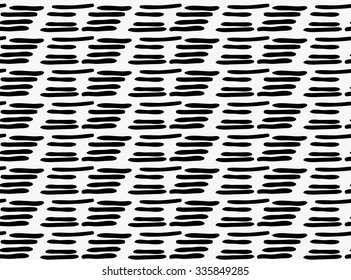 Black marker drawn simple dashes.Hand drawn with paint brush seamless background. Abstract texture. Modern irregular tilable design.