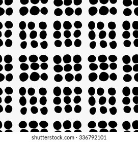 Black marker drawn simple dots forming squares.Hand drawn with paint brush seamless background. Abstract texture. Modern irregular tilable design.