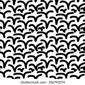 Black marker drawn simple rounded marks.Hand drawn with paint brush seamless background. Abstract texture. Modern irregular tilable design.