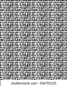 Black marker drawn simple small dots.Hand drawn with paint brush seamless background. Abstract texture. Modern irregular tilable design.