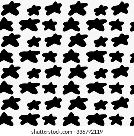 Black marker drawn simple stars.Hand drawn with paint brush seamless background. Abstract texture. Modern irregular tilable design.