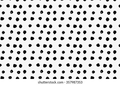 Black marker scribble dots.Free hand drawn with ink brush seamless background. Abstract texture. Modern irregular tilable design.