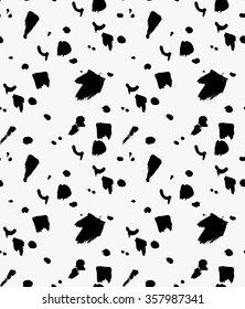 Black marker splashes and spots.Free hand drawn with ink brush seamless background. Abstract texture. Modern irregular tilable design.