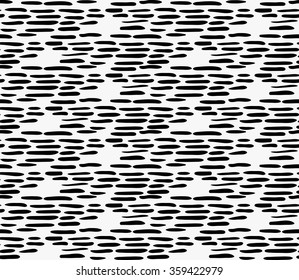 Black marker uneven hatched texture.Free hand drawn with ink brush seamless background. Abstract texture. Modern irregular tileble design.