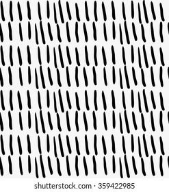 Black marker vertical strokes.Free hand drawn with ink brush seamless background. Abstract texture. Modern irregular tilable design.