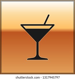 Black Martini glass icon isolated on gold background. Cocktail icon. Wine glass icon. Vector Illustration